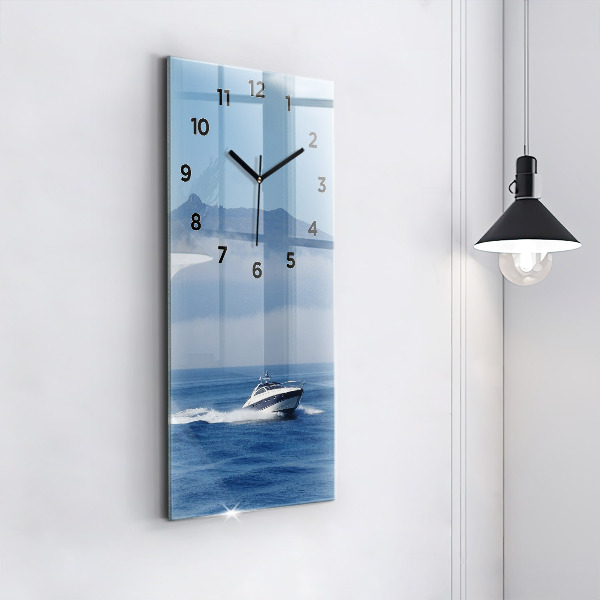Vertical wall clock A boat floating on the ocean