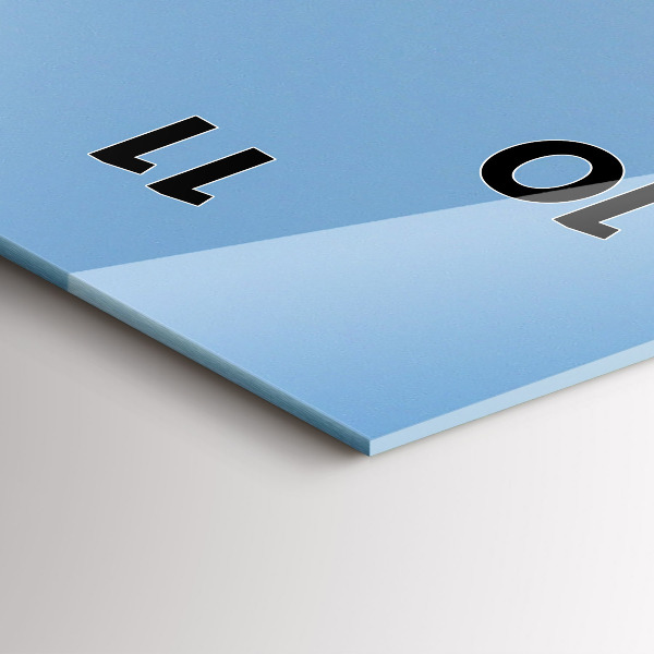 Vertical wall clock A boat floating on the ocean