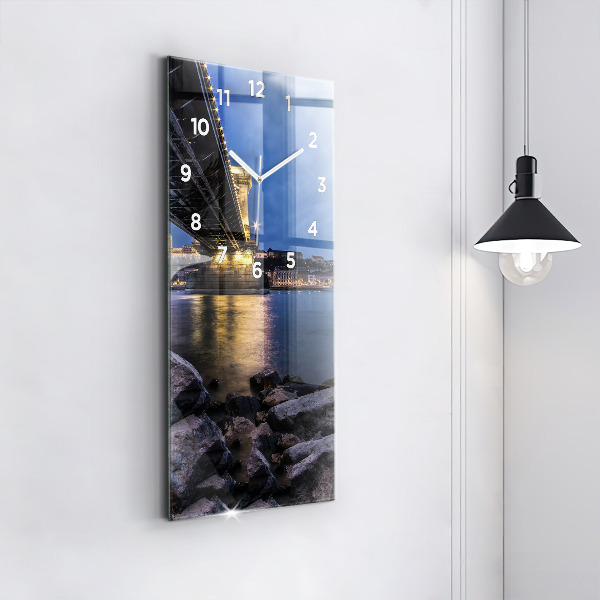 Vertical wall clock Rocky shore under the bridge