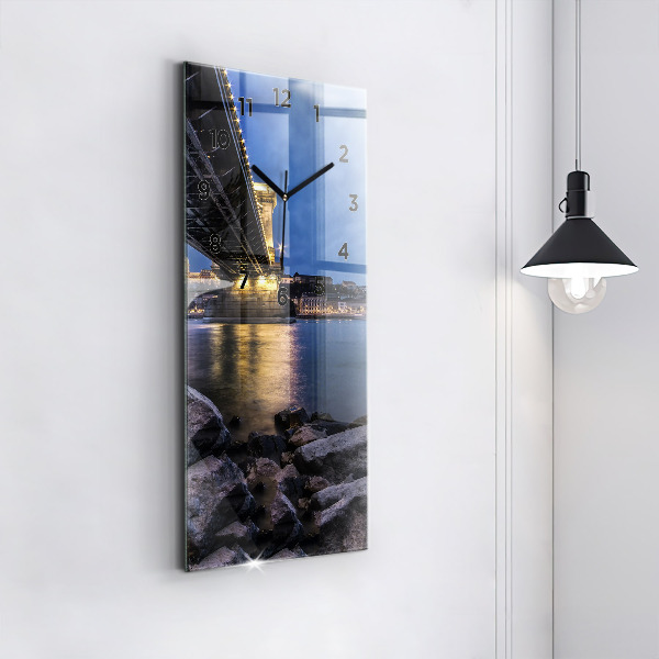 Vertical wall clock Rocky shore under the bridge