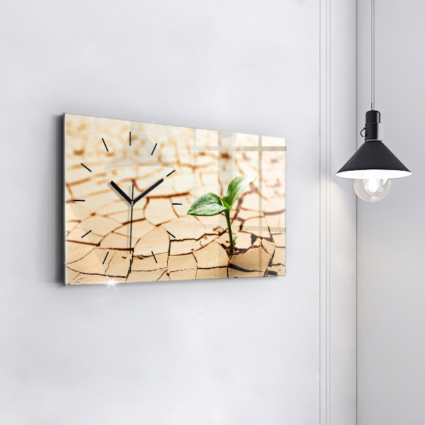 Horizontal wall clock A plant in dried-out soil