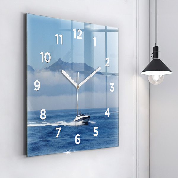 Square wall clock A boat floating on the ocean