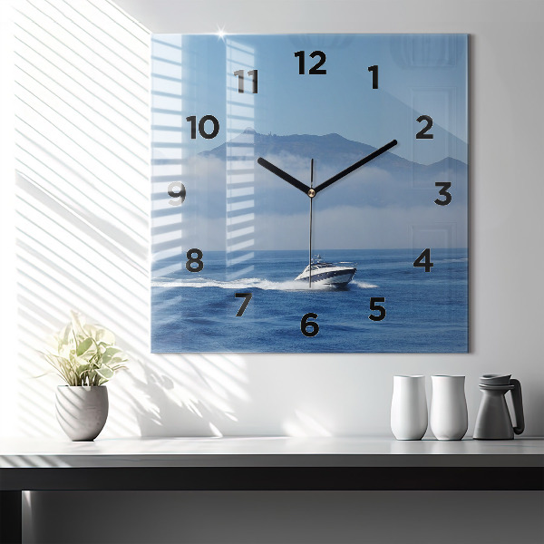 Square wall clock A boat floating on the ocean