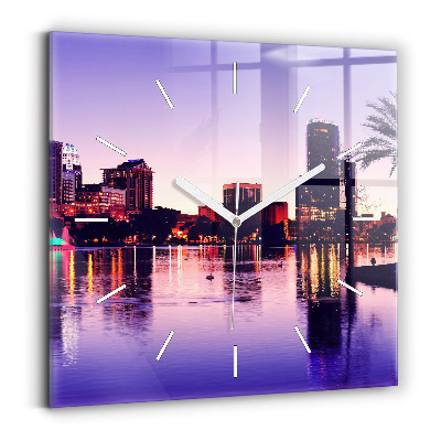 Square wall clock Evening panorama of the city