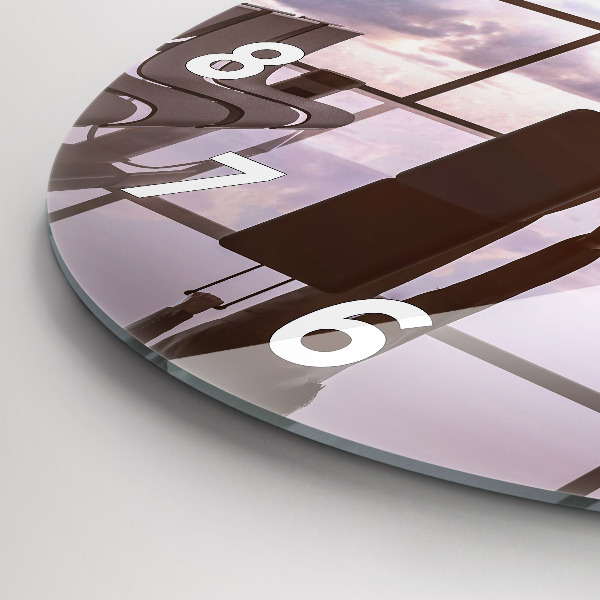 Round glass wall clock Man at the airport