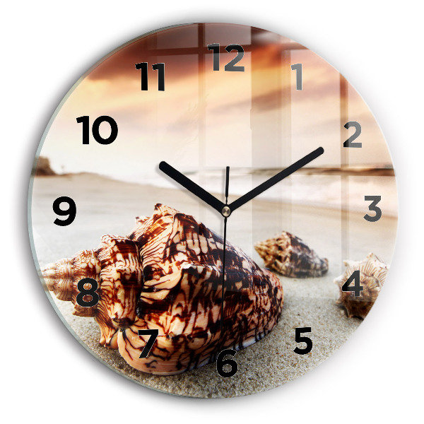 Round glass wall clock A shell on the beach