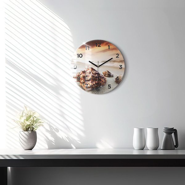 Round glass wall clock A shell on the beach