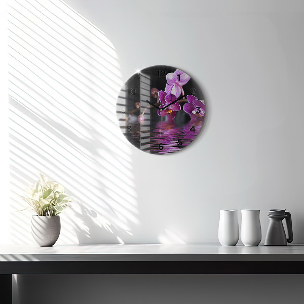 Round glass wall clock Orchid flower on the water