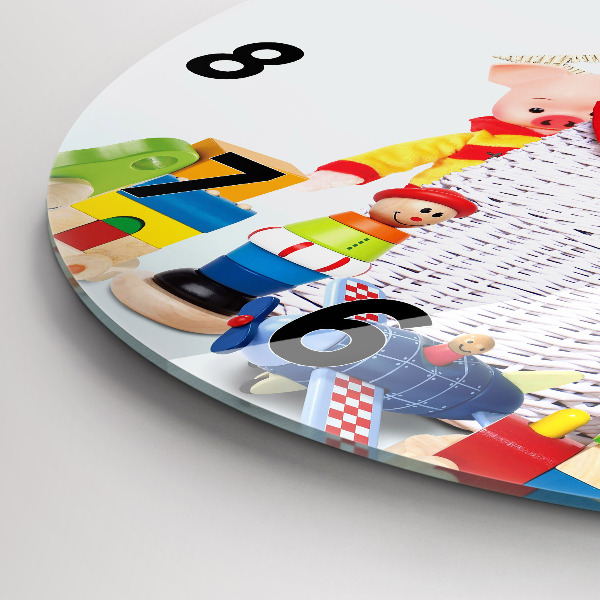 Round glass wall clock Wicker basket with toys