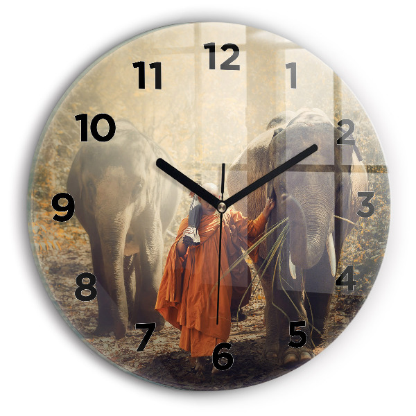 Round glass wall clock Monk leading elephants