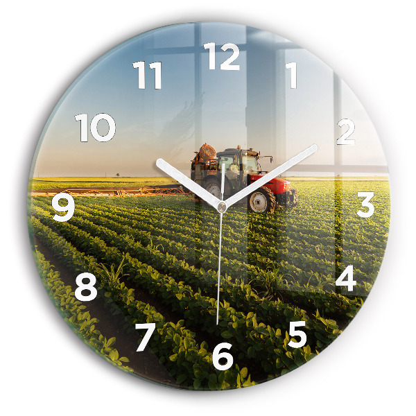 Round glass wall clock Tractor in a farm field