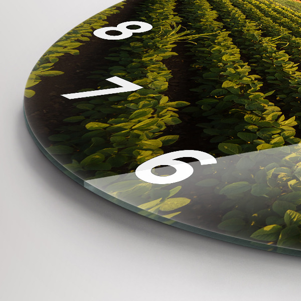 Round glass wall clock Tractor in a farm field