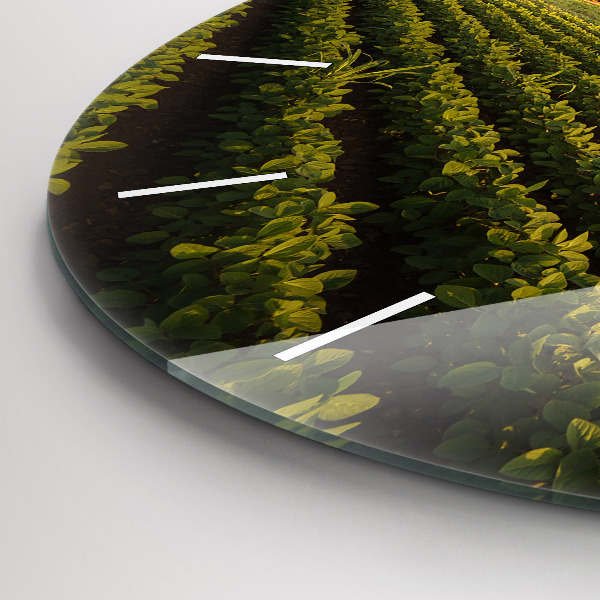 Round glass wall clock Tractor in a farm field