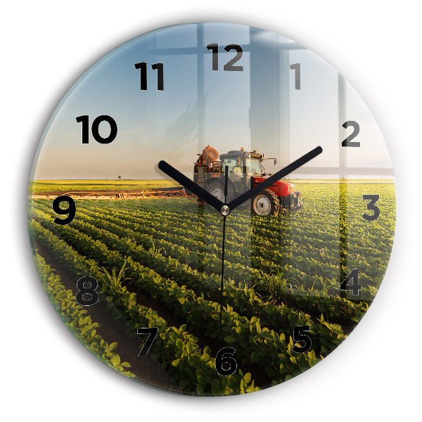 Round glass wall clock Tractor in a farm field