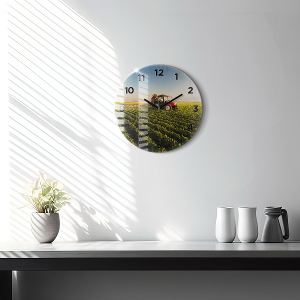 Round glass wall clock Tractor in a farm field