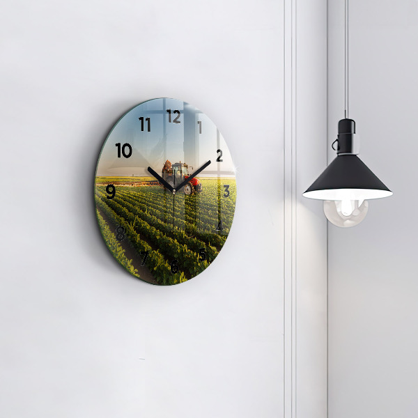 Round glass wall clock Tractor in a farm field