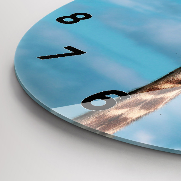 Round glass wall clock Giraffe head against the sky