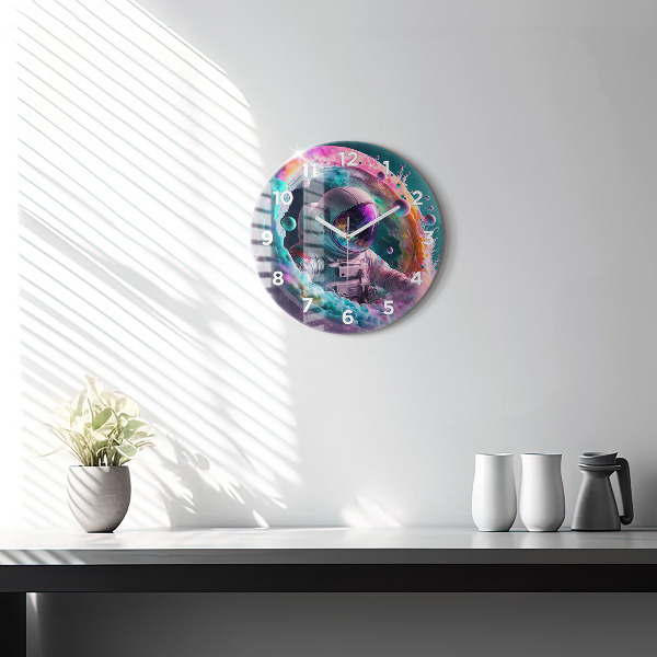 Round glass wall clock Cosmonaut and colorful clouds