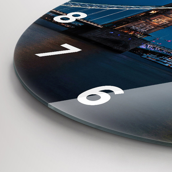 Round glass wall clock Tower Bridge London at night