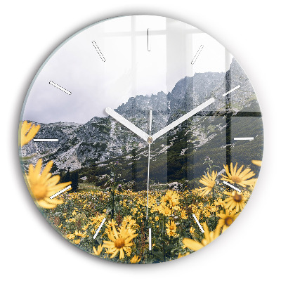 Round glass wall clock Meadow flowers in the mountains