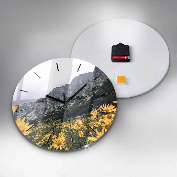 Round glass wall clock Meadow flowers in the mountains