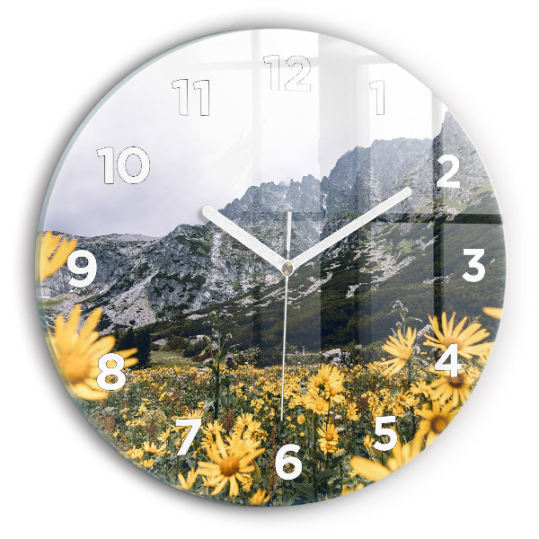 Round glass wall clock Meadow flowers in the mountains