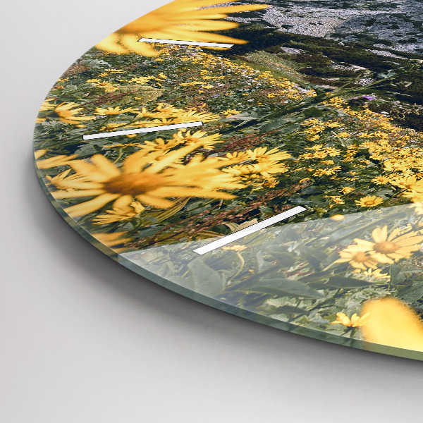 Round glass wall clock Meadow flowers in the mountains