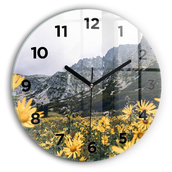 Round glass wall clock Meadow flowers in the mountains