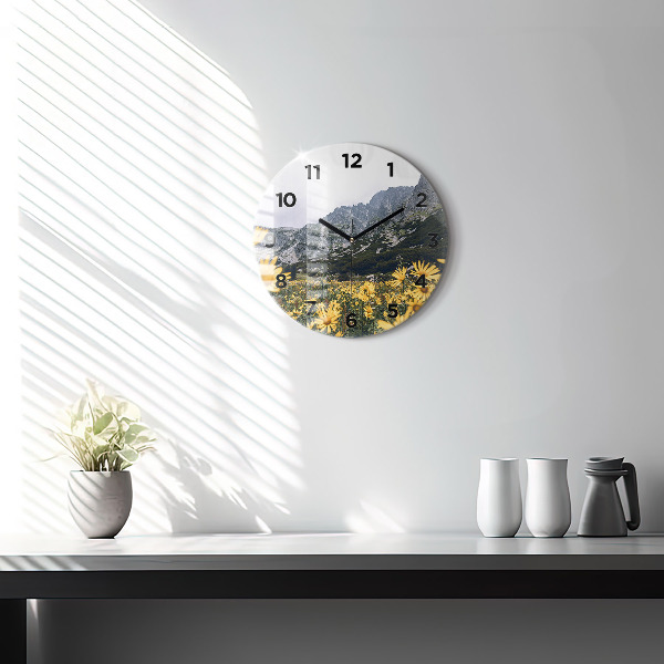 Round glass wall clock Meadow flowers in the mountains