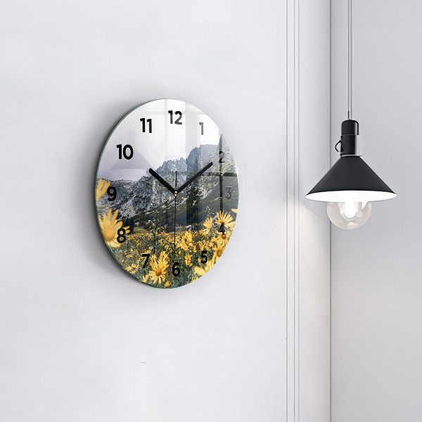 Round glass wall clock Meadow flowers in the mountains