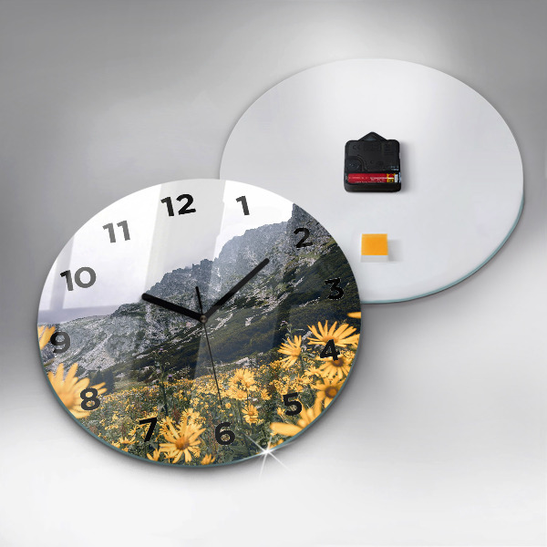 Round glass wall clock Meadow flowers in the mountains
