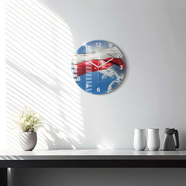Round glass wall clock The Polish flag against the sky