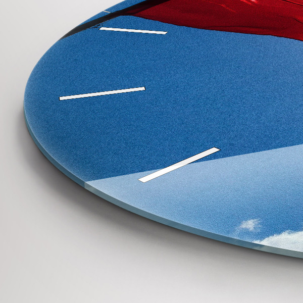 Round glass wall clock The Polish flag against the sky