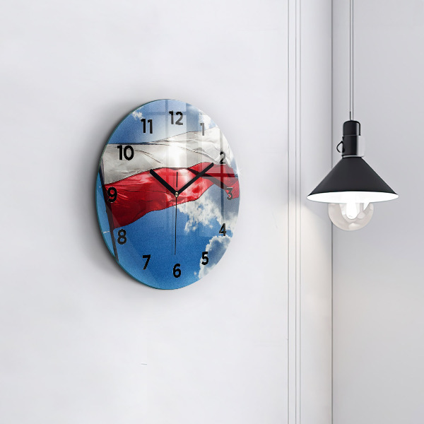 Round glass wall clock The Polish flag against the sky
