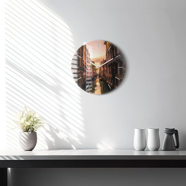 Round glass wall clock View of the canal in the city