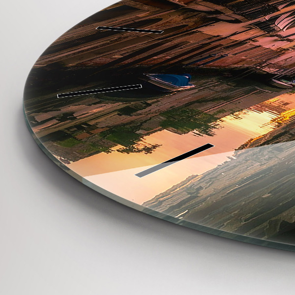 Round glass wall clock View of the canal in the city