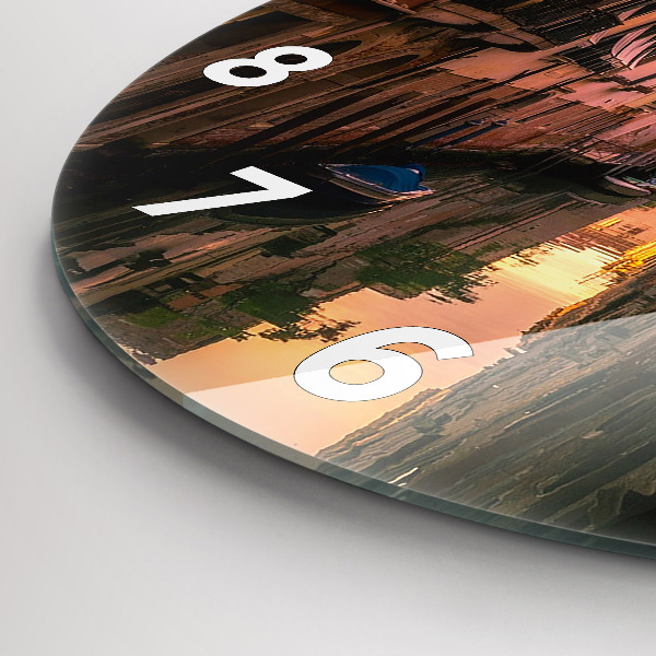 Round glass wall clock View of the canal in the city
