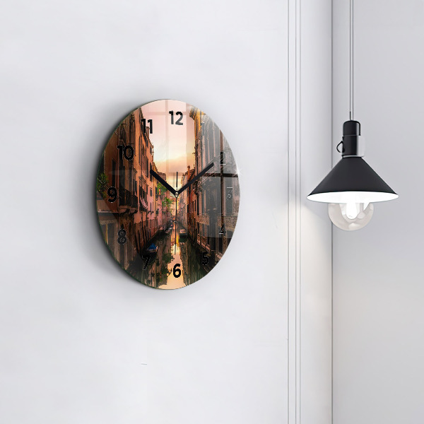 Round glass wall clock View of the canal in the city