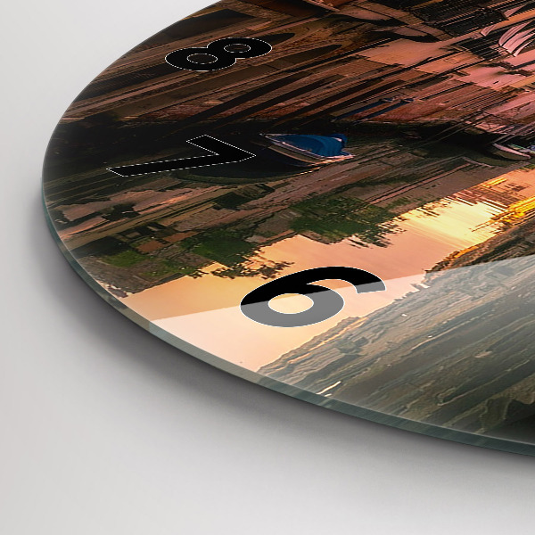 Round glass wall clock View of the canal in the city