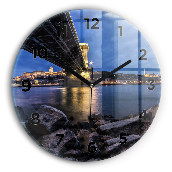 Round glass wall clock Rocky shore under the bridge