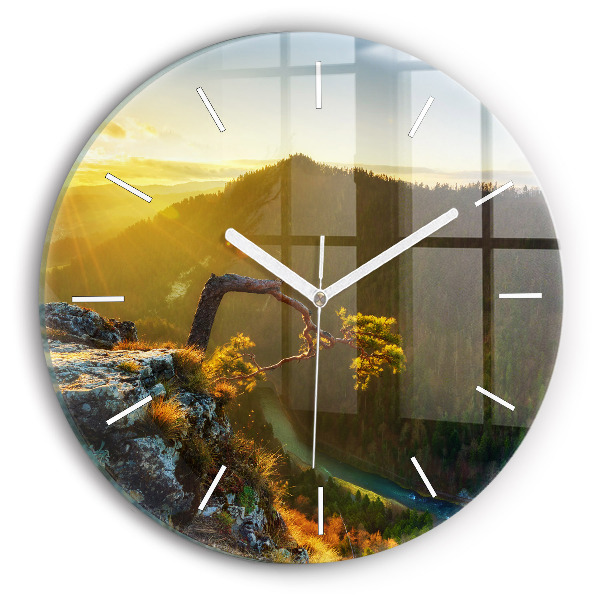Round glass wall clock Sunset over the mountains