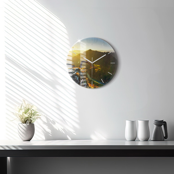 Round glass wall clock Sunset over the mountains