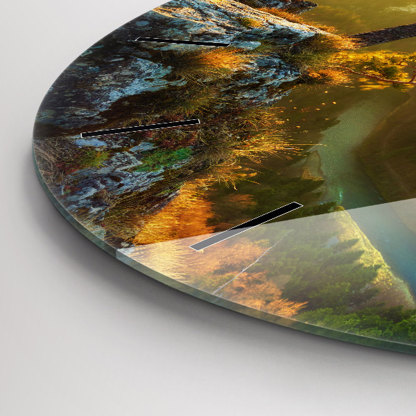 Round glass wall clock Sunset over the mountains