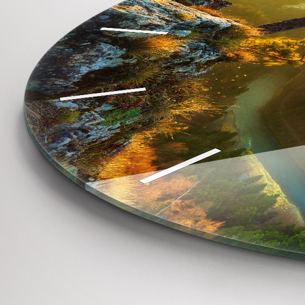 Round glass wall clock Sunset over the mountains