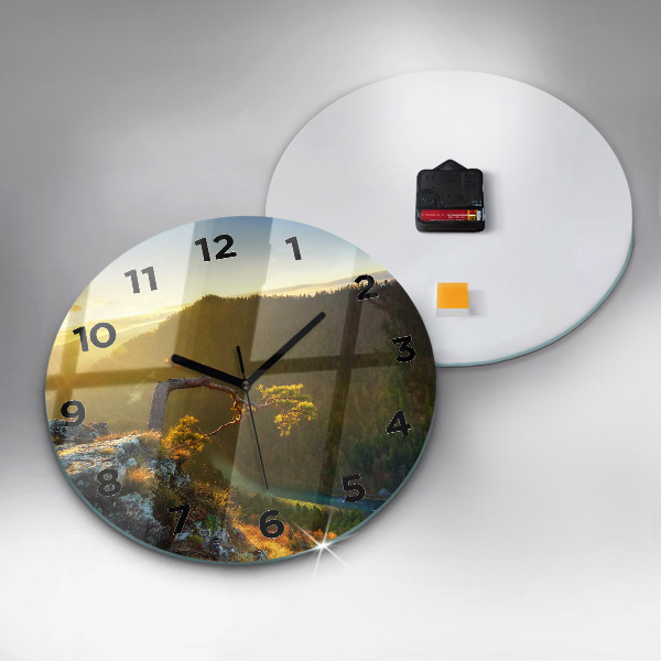 Round glass wall clock Sunset over the mountains
