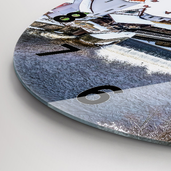 Round glass wall clock Panorama of the city in winter