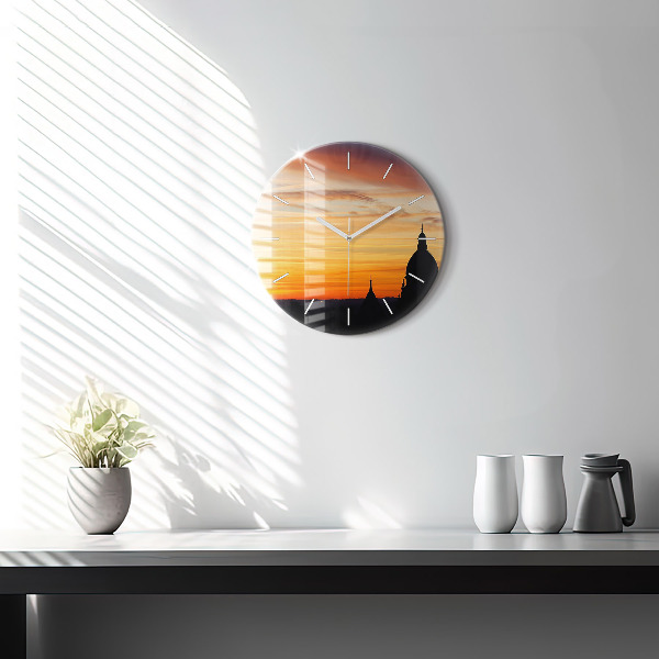 Round glass wall clock Building and sunset