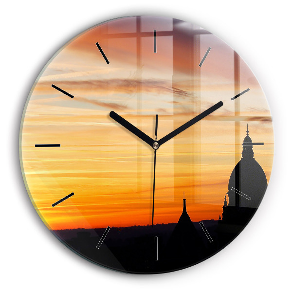 Round glass wall clock Building and sunset
