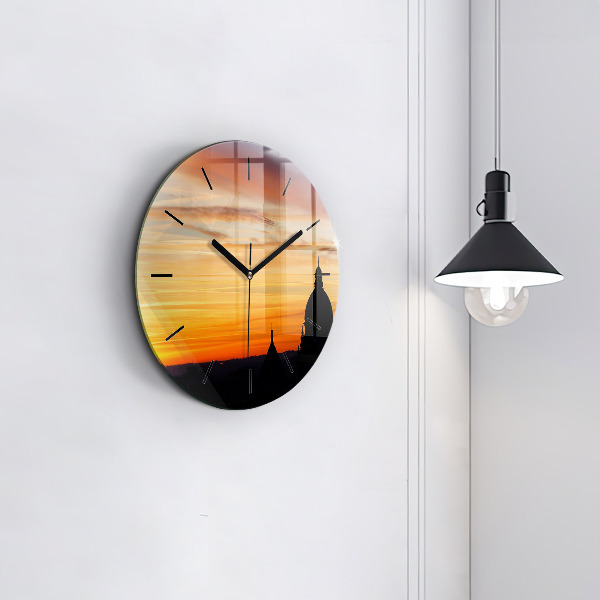 Round glass wall clock Building and sunset
