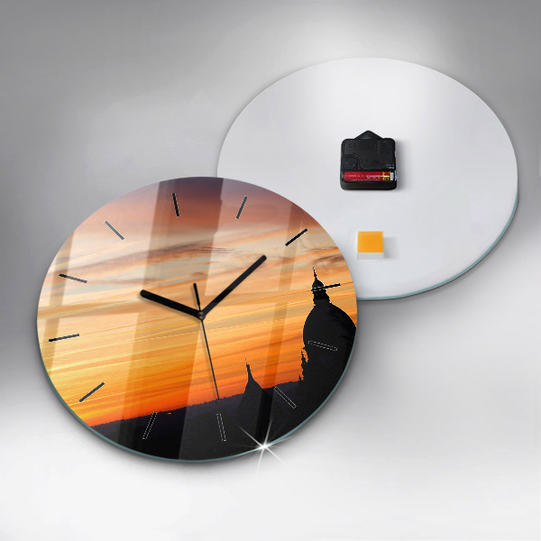 Round glass wall clock Building and sunset